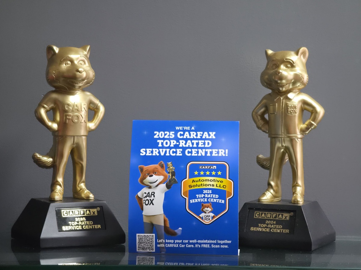 CARFAX Top-Rated Service Center trophies for 2024 and 2025