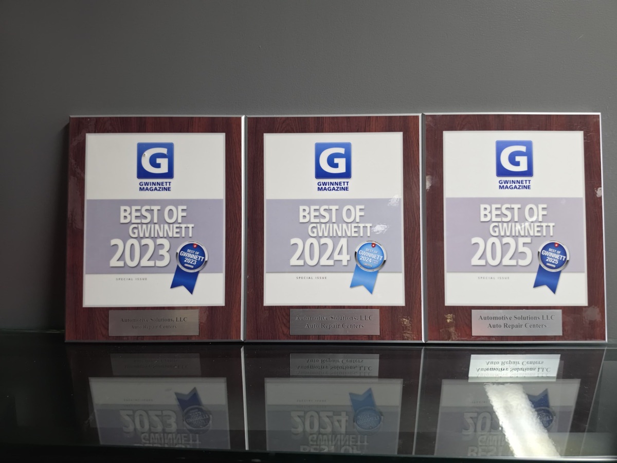 Gwinnett Magazine Best of Gwinnett plaques for 2023, 2024 and 2025 on the shop wall