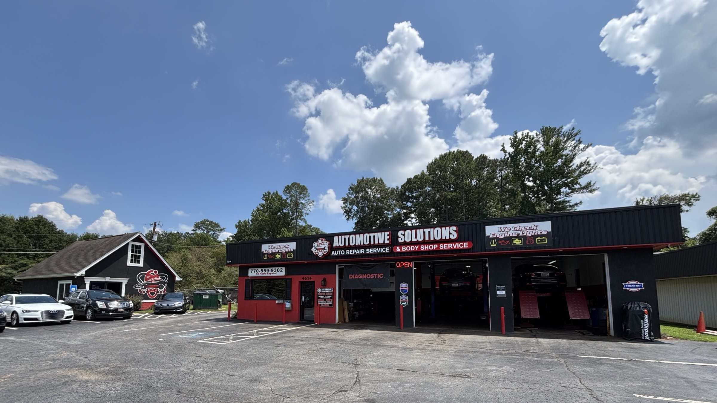The Automotive Solutions shop on Stone Mountain Highway in Lilburn, service bays open