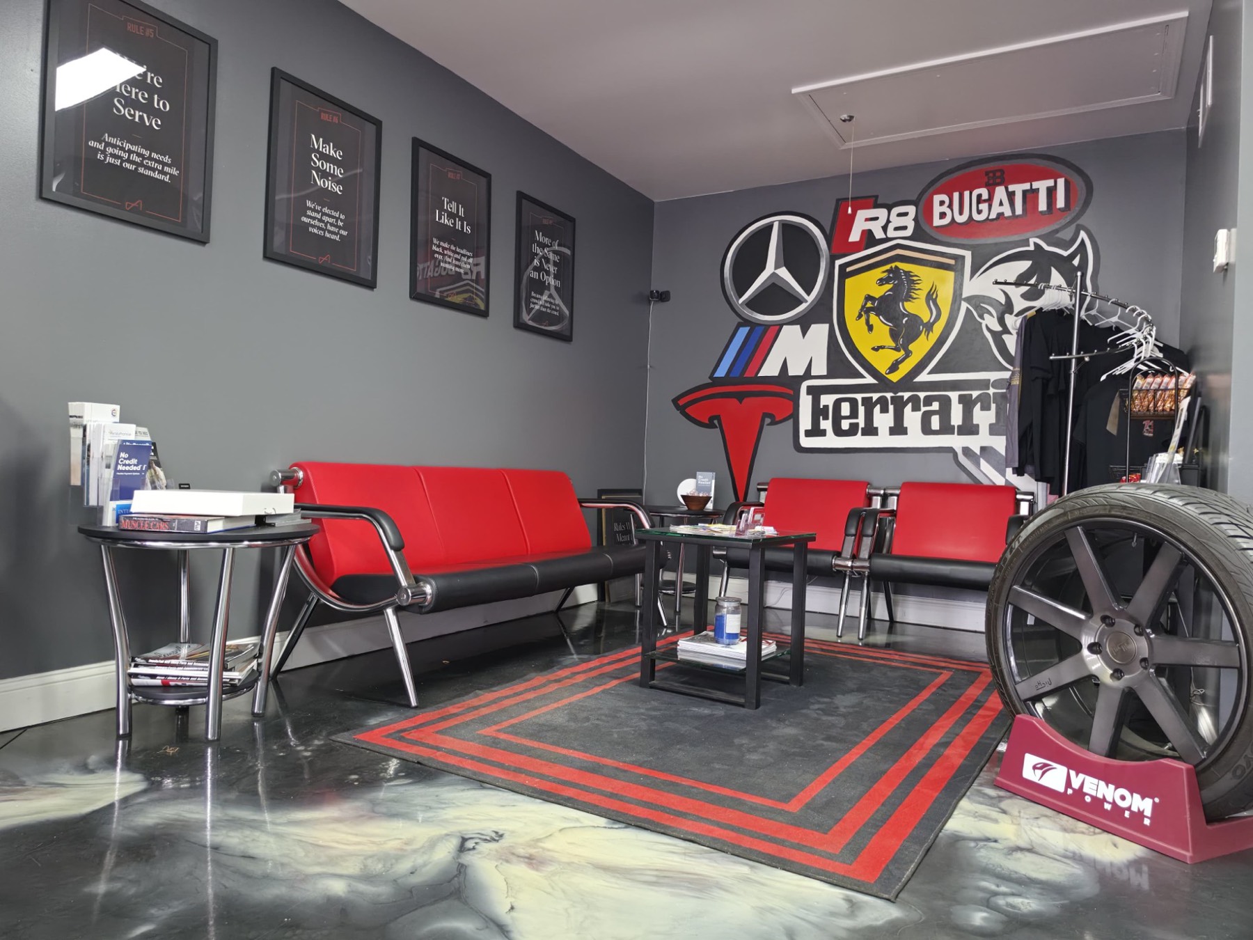 The Automotive Solutions customer lounge, with a marbled epoxy floor and red seating