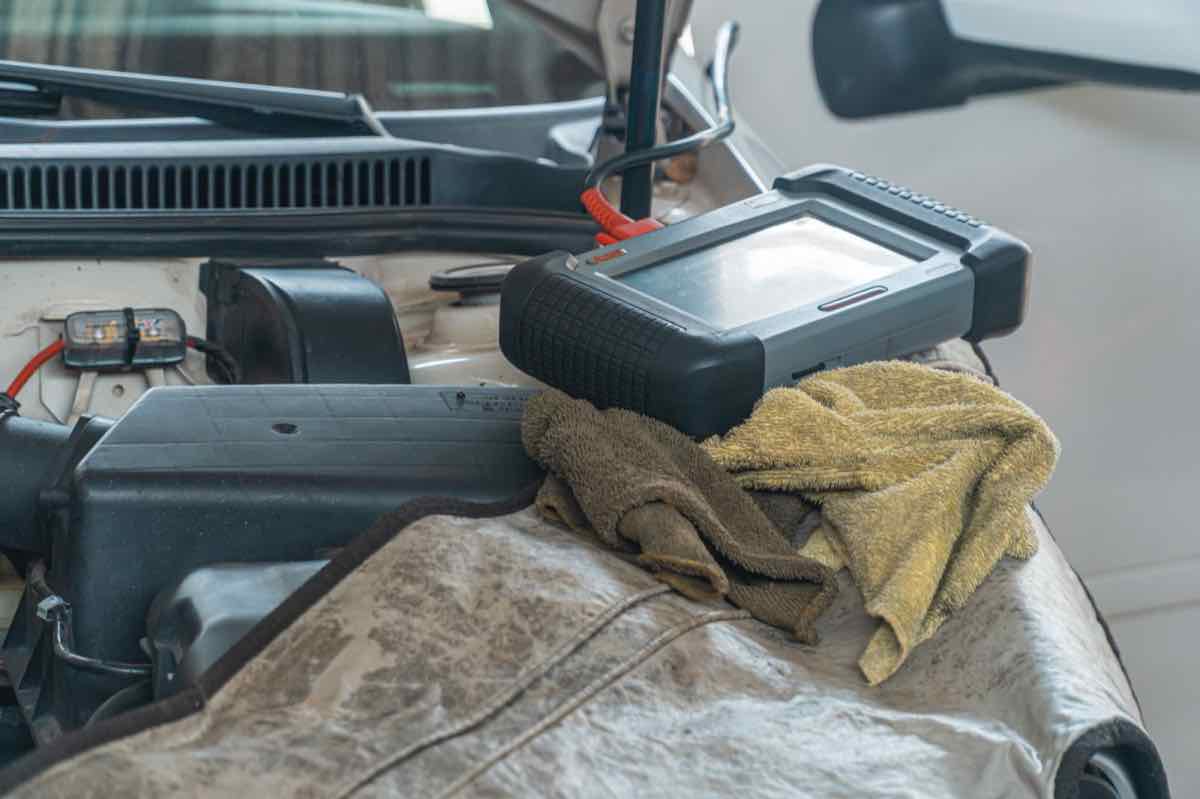 A diagnostic scan tool connected to a vehicle at Automotive Solutions